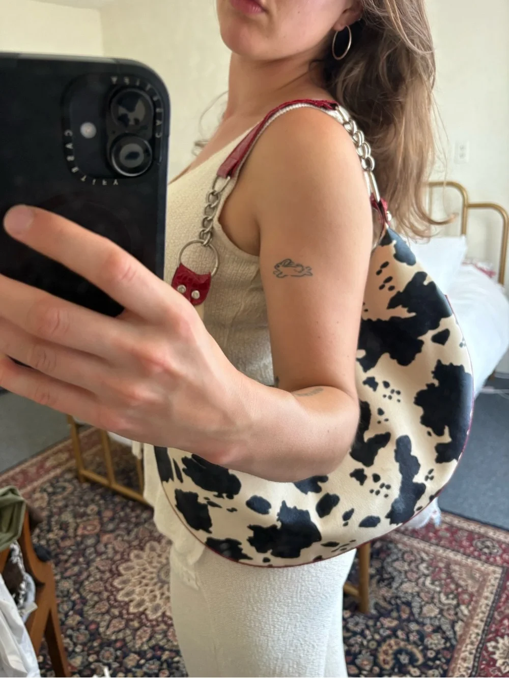 Cow-Print Black & Cream Hobo Bag with Red Trim